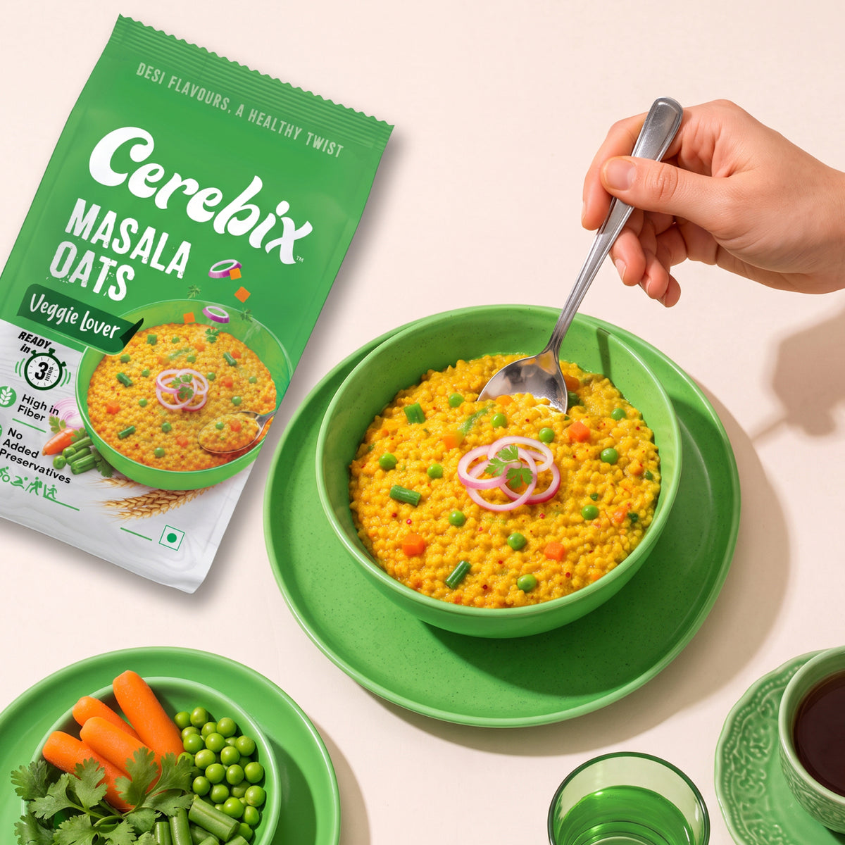 spoon over a green bowl of veggie oats
